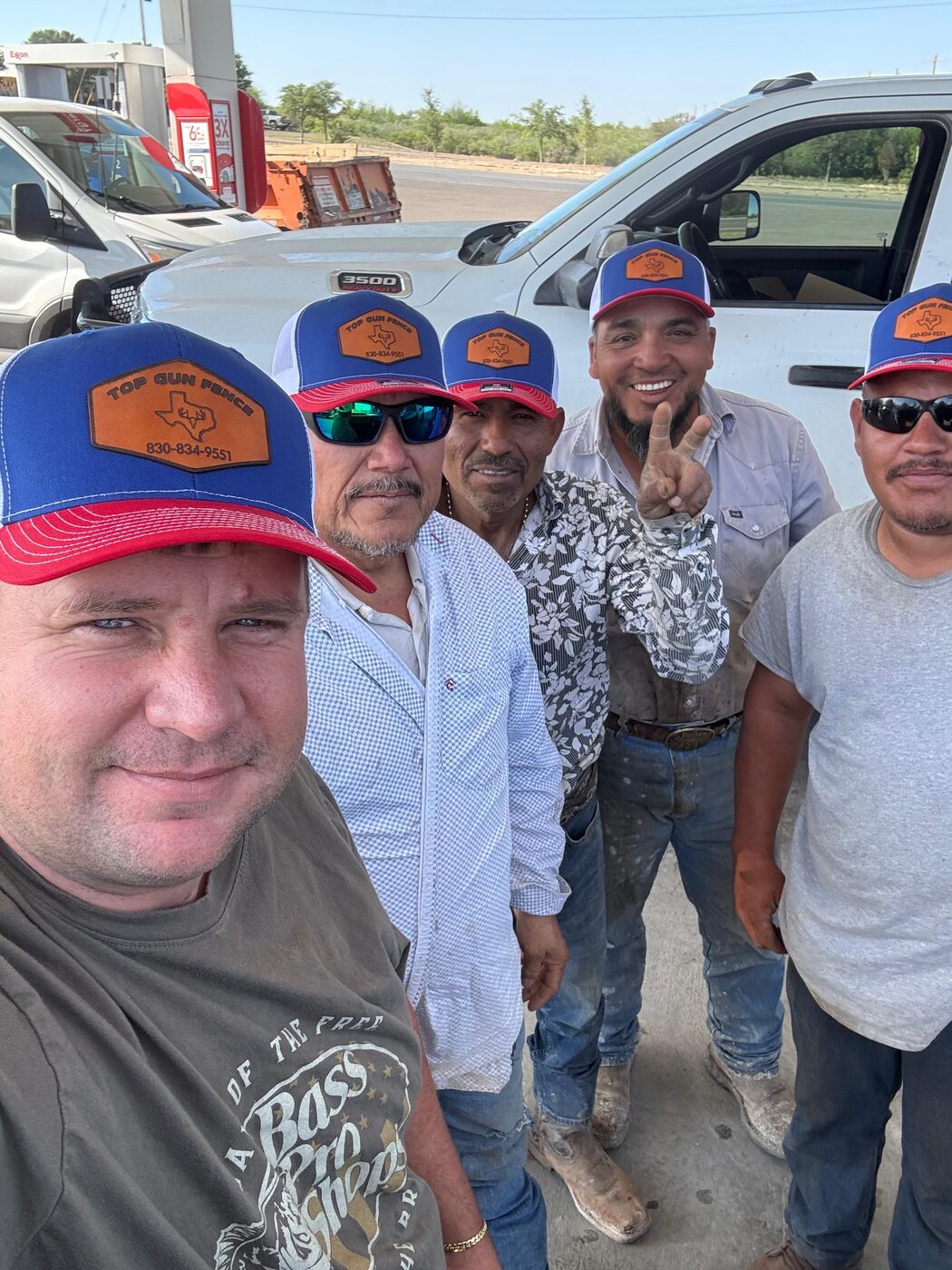 The Top Gun Fence crew in company caps, ready to head out to the job